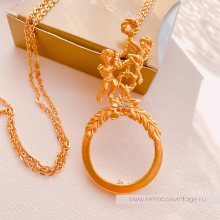 AVON Ожерелье-лорнет с лупой "Два ангелочка" 1997 г.