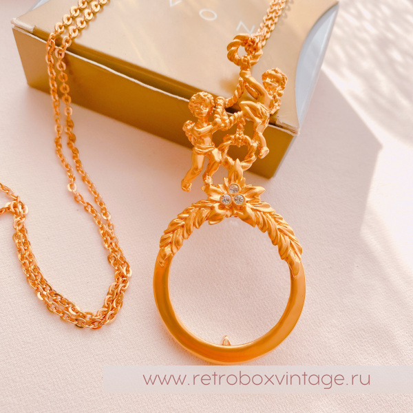 AVON Ожерелье-лорнет с лупой "Два ангелочка" 1997 г.