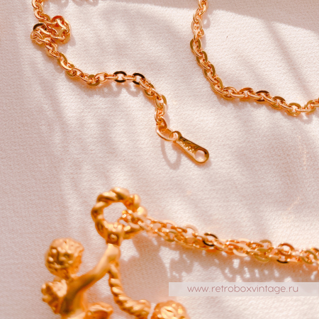 AVON Ожерелье-лорнет с лупой "Два ангелочка" 1997 г.