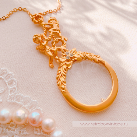 AVON Ожерелье-лорнет с лупой "Два ангелочка" 1997 г.