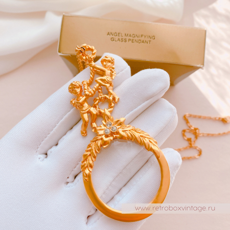 AVON Ожерелье-лорнет с лупой "Два ангелочка" 1997 г.